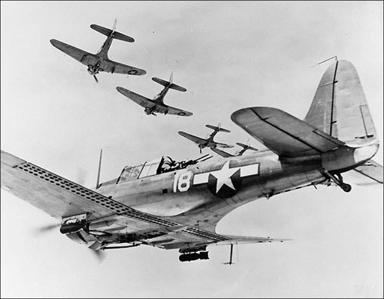 Description: Description: Five VB-10 SBDs in formation, March 1944.