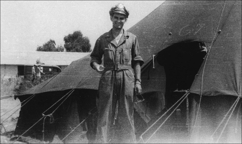 Navigator Dick Alhouse in front of his tent